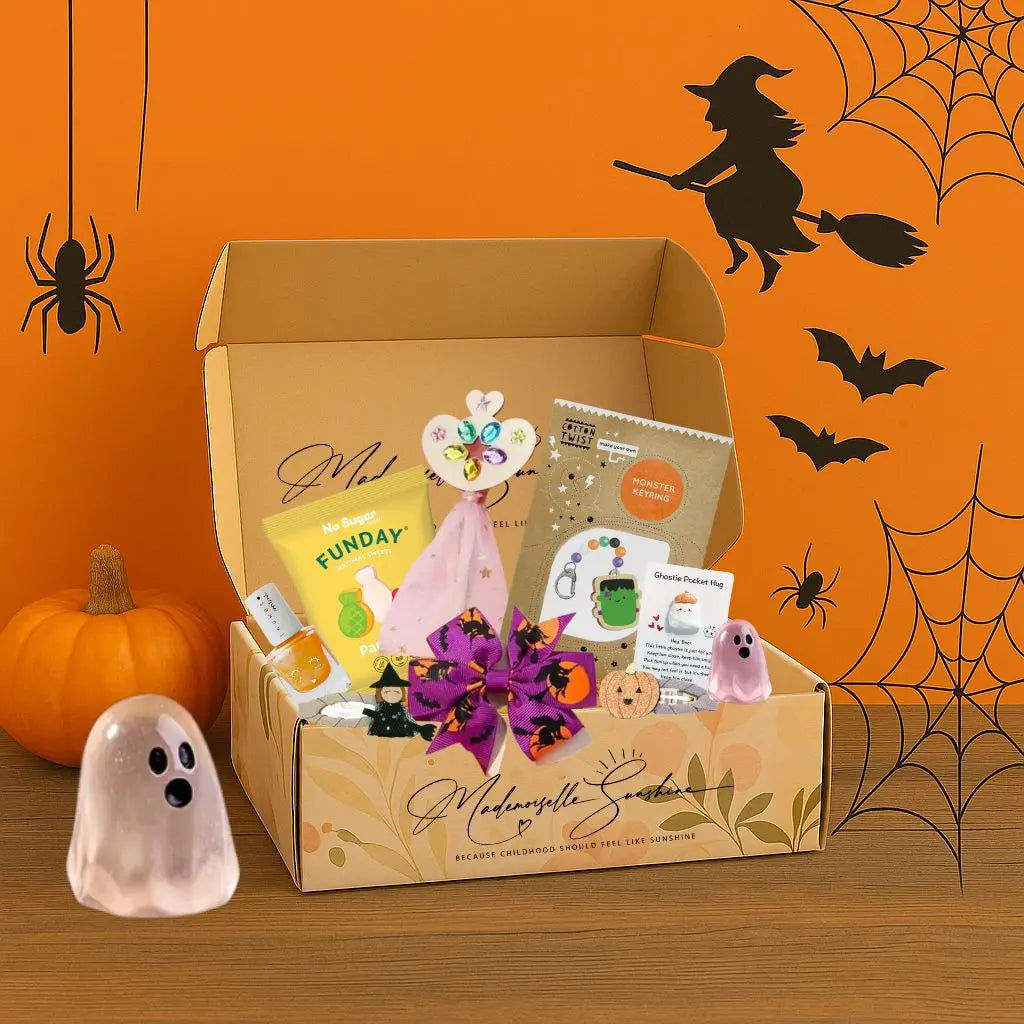 Halloween kids activity box with DIY crafts, sweets, and accessories