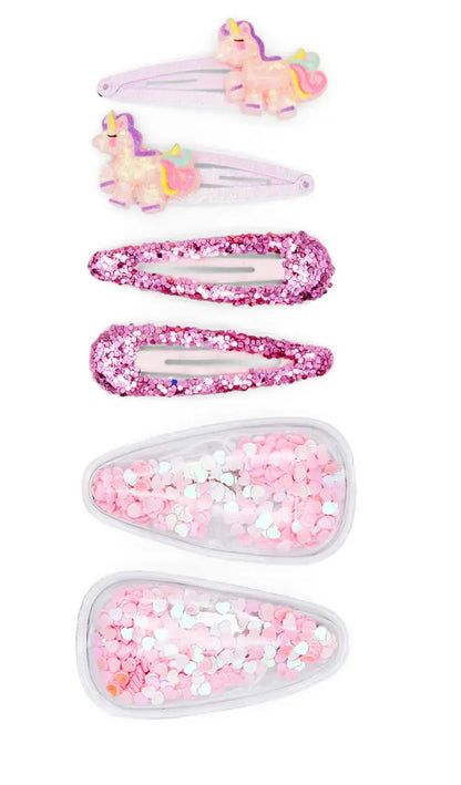 Set of five colorful hair clips with unicorn designs on a white background