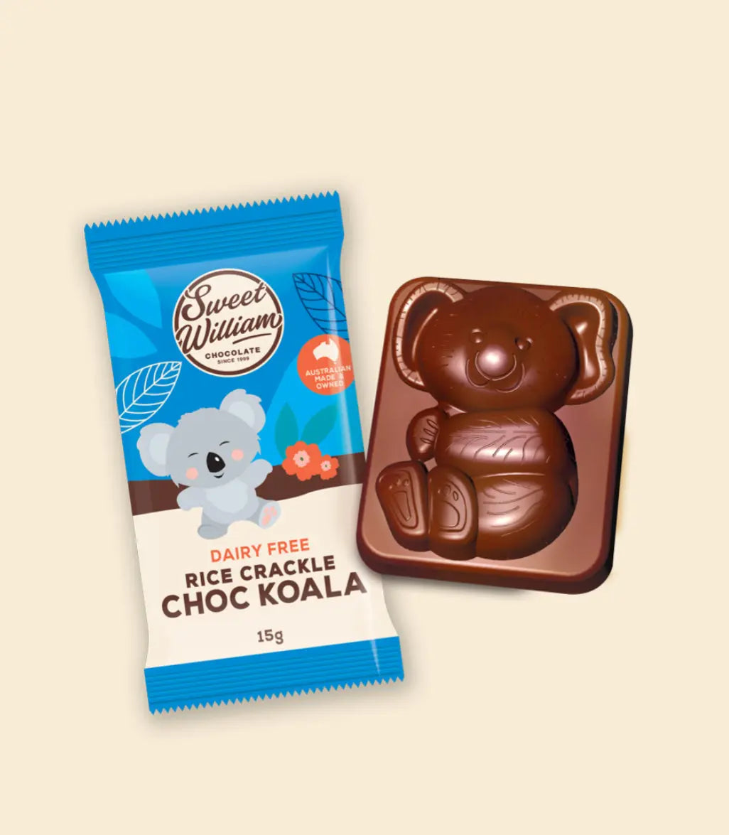 Chocolate koala shaped bar next to its packaging on a beige background