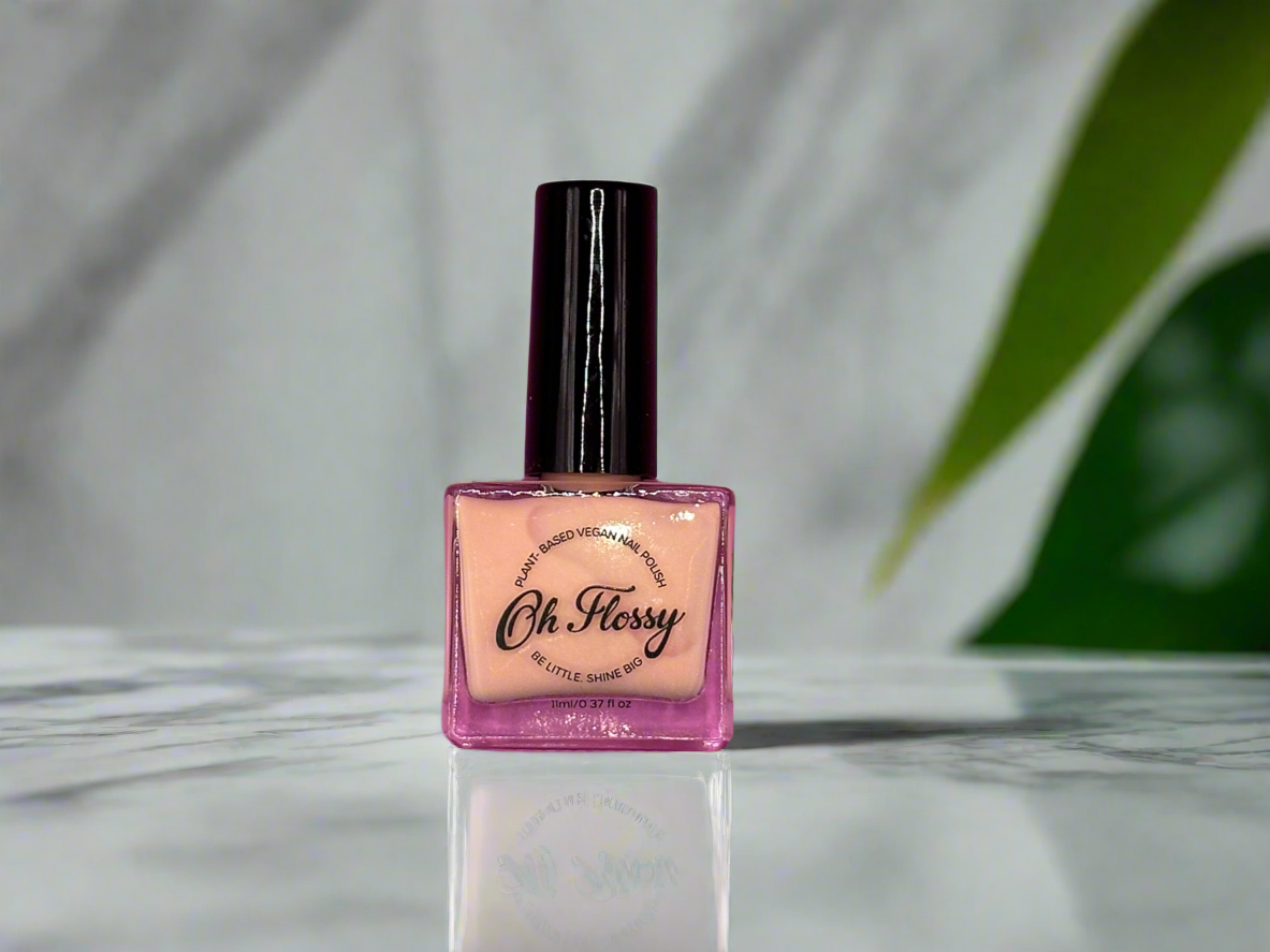 OH Flossy nail polish sitting on a bathroom table.