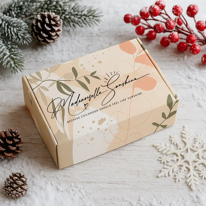 Product packaging with decorative elements on a light surface