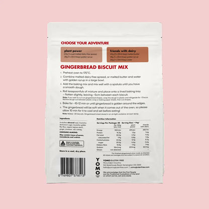 Back of a gingerbread biscuit mix packaging with text and ingredients on a pink background